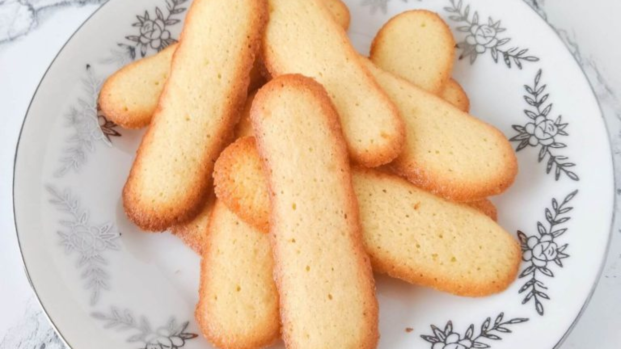 https://www.assortedeats.com/wp-content/uploads/2021/04/Langue-de-Chat-Cookies-Close-Up-2-768x1024.jpg